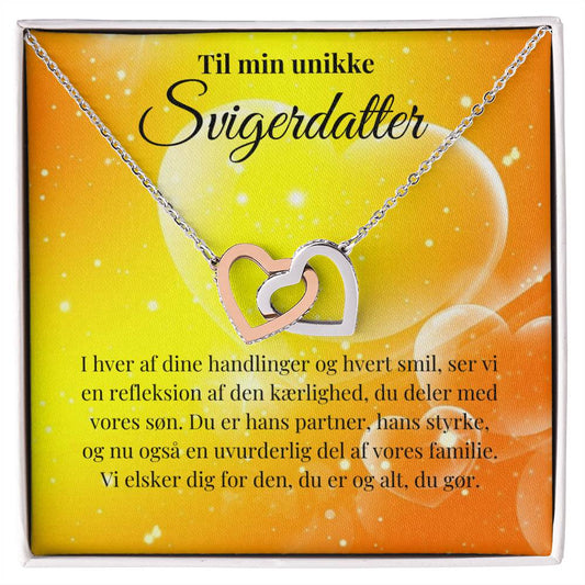 Unik halskæde med sammensmedet hjerter som symbol på kærlighed til svigerdatter fra svigermor eller svigerfar